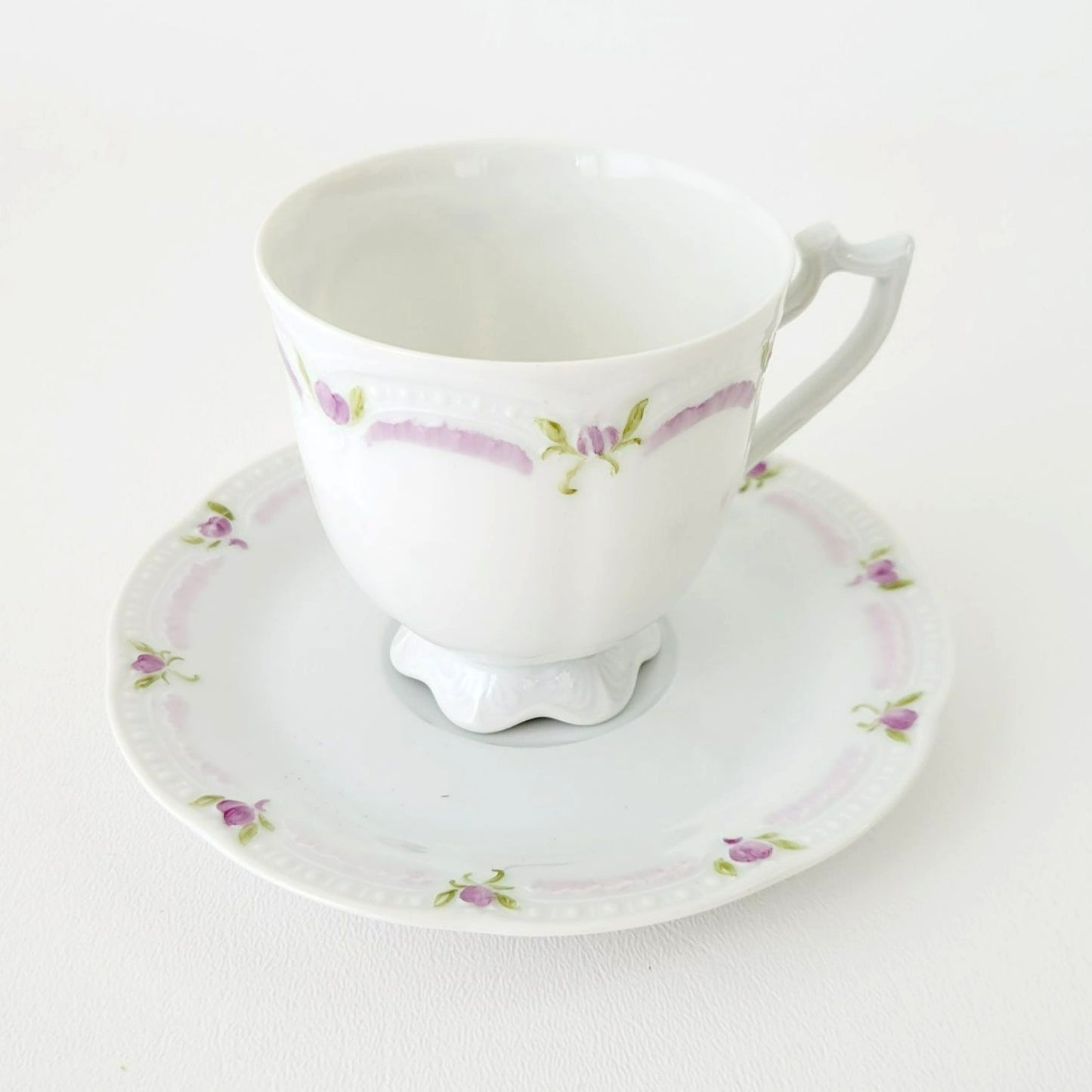 Hutschenreuther Viktoria Teacup & Saucer, White Embossed with Hand Painted Purple & Green Painted Floral, Artist Signed, Germany