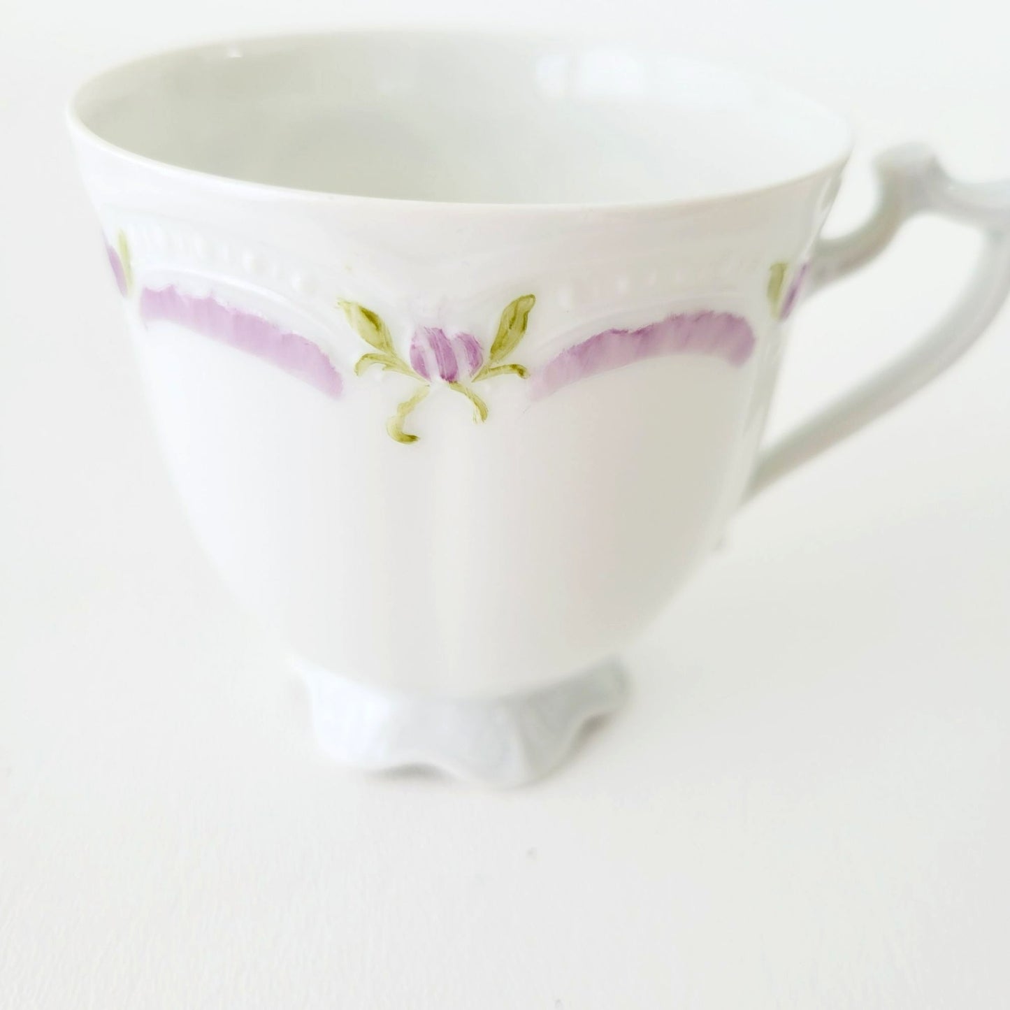 Hutschenreuther Viktoria Teacup & Saucer, White Embossed with Hand Painted Purple & Green Painted Floral, Artist Signed, Germany