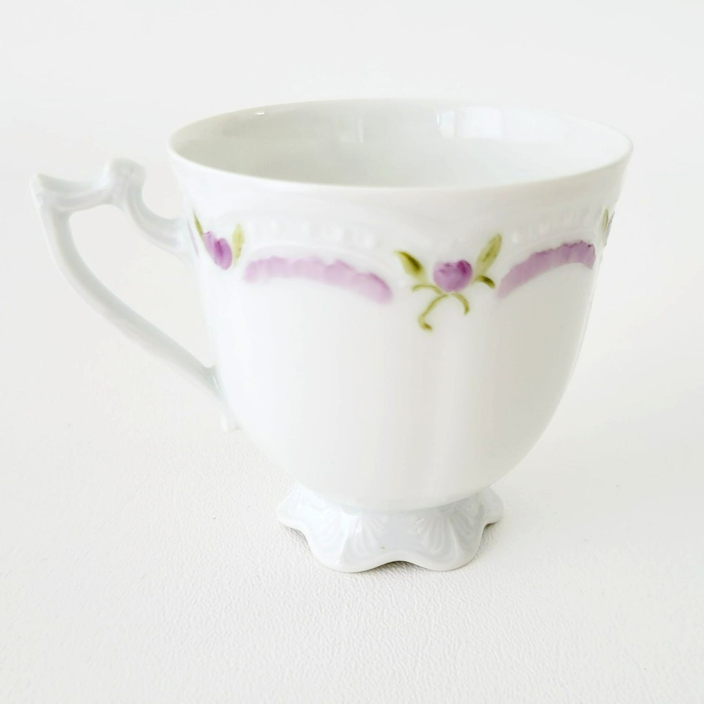 Hutschenreuther Viktoria Teacup & Saucer, White Embossed with Hand Painted Purple & Green Painted Floral, Artist Signed, Germany