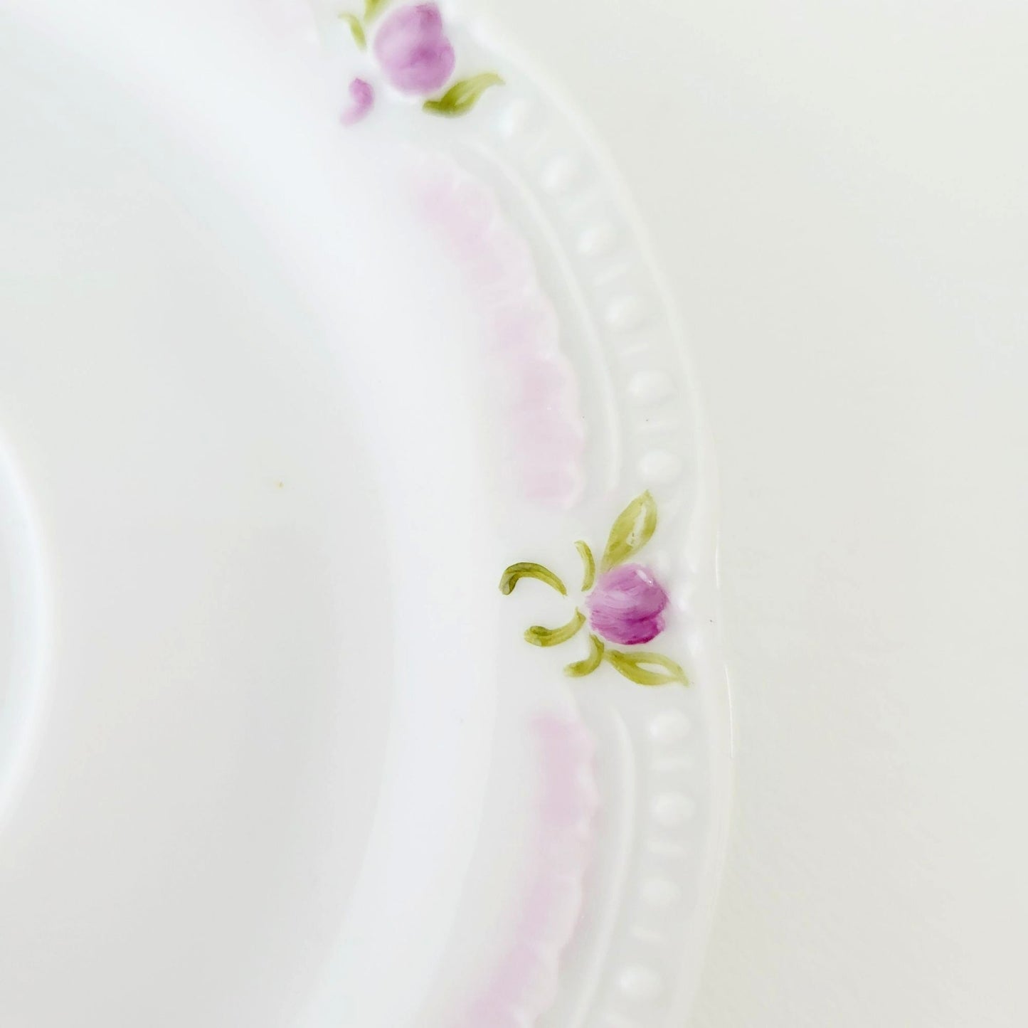 Hutschenreuther Viktoria Teacup & Saucer, White Embossed with Hand Painted Purple & Green Painted Floral, Artist Signed, Germany