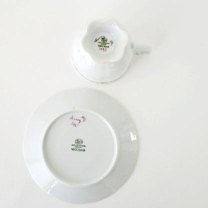 Hutschenreuther Viktoria Teacup & Saucer, White Embossed with Hand Painted Purple & Green Painted Floral, Artist Signed, Germany