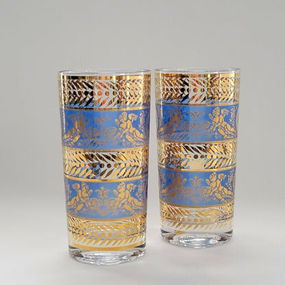 Two decorative glasses with gold and blue patterns on a gray background